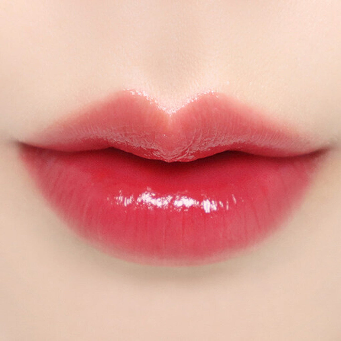 ProtoClinical k-beauty BBIA Ready To Wear Water Lipstick 3g rosy red lipstick swatch stretched horizontally on a pale peach background