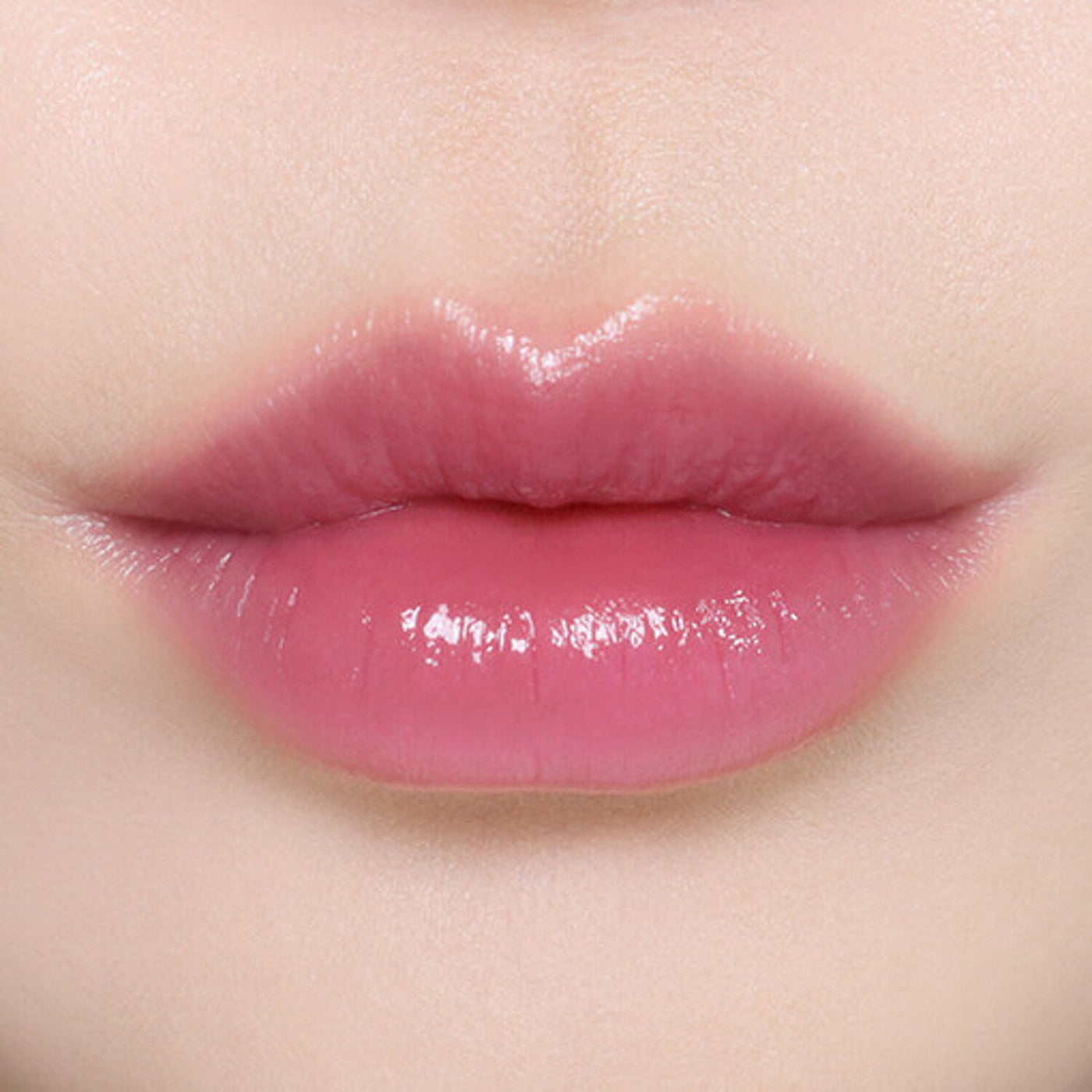 ProtoClinical k-beauty BBIA Ready To Wear Water Lipstick 3g warm coral lipstick swatch stretched horizontally on a pale peach background
