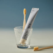 AROMATICA Tea Tree Balancing Toothpaste 100ml product packaging and tube on a light background