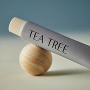 AROMATICA Tea Tree Balancing Toothpaste 100ml product packaging and tube on a light background