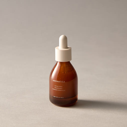 ProtoClinical k-beauty AROMATICA Vitalizing Rosemary Firming Ampoule 30ml single upright dark ampoule bottle centered on a pale green and beige background