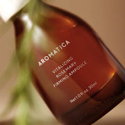 ProtoClinical k-beauty AROMATICA Vitalizing Rosemary Firming Ampoule 30ml close-up dark ampoule bottle angled on an olive green background