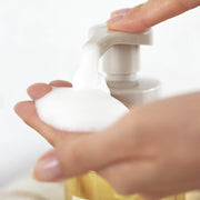 ProtoClinical k-beauty AROMATICA Zesty Hand Soap Grapefruit & Tangerine 300ml (Refill) single upright pale peach hand soap refill package centered on a pale blue and warm peach background.