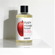 ProtoClinical k-beauty CURESYS Apple Vinegar Toner 300ml single upright toner bottle centered on a white background with pale yellow and olive tones