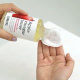 ProtoClinical k-beauty CURESYS Apple Vinegar Toner 300ml single upright toner bottle centered on a light background with warm beige and soft olive accents