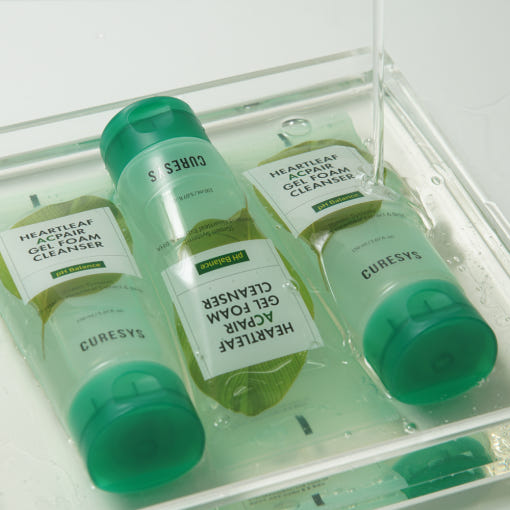 ProtoClinical k-beauty CURESYS Heartleaf Acpair Gel Foam Cleanser 150ml with three mint-green tubes arranged in a clear water tray, including one upside down
