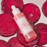ProtoClinical k-beauty I'm from Beet Energy Ampoule 30ml single upright rose ampoule bottle centered on a deep berry background with soft pink highlights