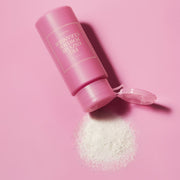 ProtoClinical k-beauty pink cosmetic product packaging on a light background.