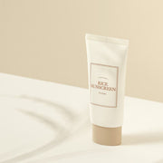 ProtoClinical k-beauty beige cosmetic product packaging on a light cream background.