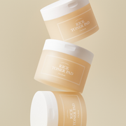 ProtoClinical k-beauty three beige beauty product shapes on a pale blue background.