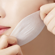 ProtoClinical k-beauty warm beige beauty graphic with a soft peach center on a light background.