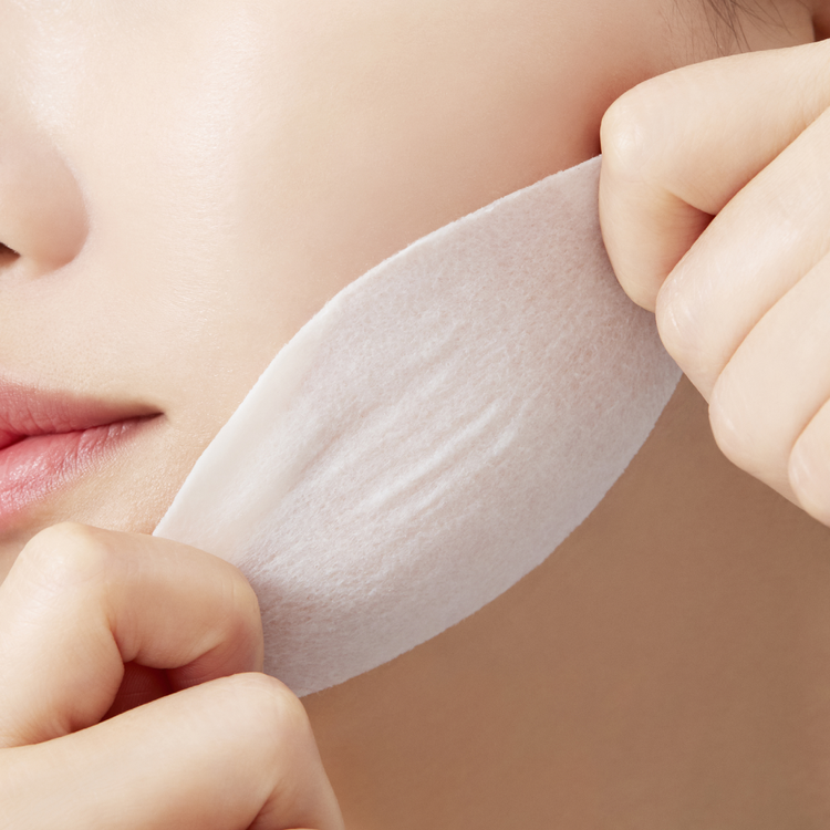 ProtoClinical k-beauty warm beige beauty graphic with a soft peach center on a light background.