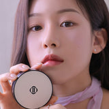 ProtoClinical k-beauty Dinto Blur-Finish Cushion 12g beauty graphic with a centered rounded compact form in a square crop on a light background.