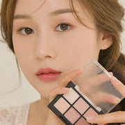 ProtoClinical k-beauty Dinto Blur-Finish Shadow 5.4g #705 Mary Shelley portrait makeup look on a woman with brown eyeshadow, a neutral lip, and soft skin tones