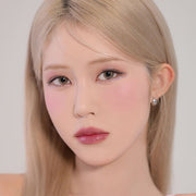 ProtoClinical k-beauty Dinto Blur-Finish Shadow 5.4g #707 J.M. Barrie close-up portrait of a blonde model with pink shimmer eye makeup, rosy blush, and glossy mauve lips