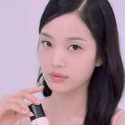 ProtoClinical k-beauty peach-beige vertical beauty product with a dark brown right side on a pale lavender background.