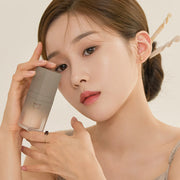 ProtoClinical k-beauty Dinto Wooncho Blur-Glowy Foundation 25ml single upright foundation bottle centered on a clean white background