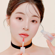 ProtoClinical k-beauty Dinto [Le Chat botte] Blur-Jelly Plumping Lip Tint 3.5g single upright pink lip tint package centered on a cream background with warm brown top corners