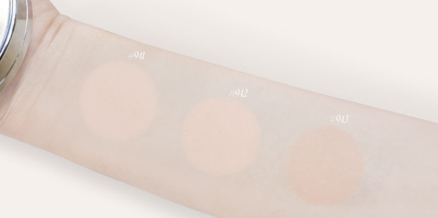 ProtoClinical k-beauty wide beauty graphic with warm beige product silhouettes and pale blue accents on a white background.