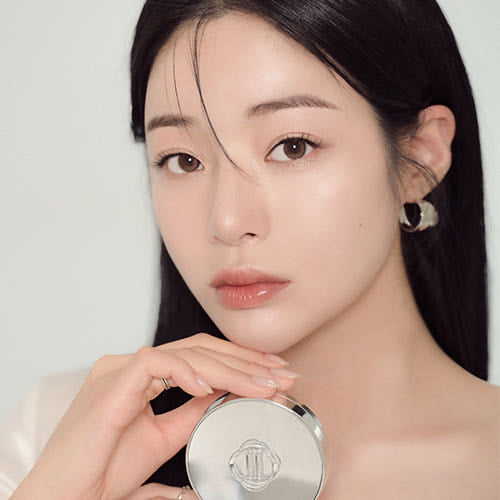 ProtoClinical k-beauty peach-beige beauty product with a pale aqua left side and dark brown right edge on a light background.