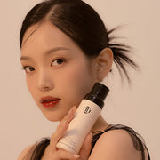 ProtoClinical k-beauty Dinto [Wooncho Collection] Last Makeup Fixer Matte 100ml single upright bottle centered on a white background with a muted beige body and darker cap