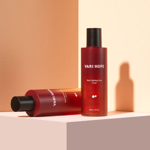 ProtoClinical k-beauty warm beige beauty product silhouette with a darker horizontal base on a soft peach background.