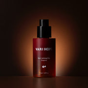 ProtoClinical k-beauty dark brown beauty product on a black background.