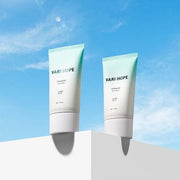 ProtoClinical k-beauty VARIHOPE UV Waterful Sun cream SPF50+ PA++++ 50g multiple aqua and sky-blue sun cream packages arranged side by side on a cool blue background.