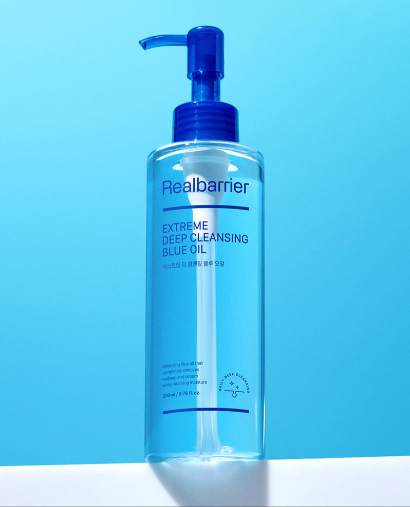 ProtoClinical k-beauty [Real Barrier] Extreme Deep Cleansing Blue Oil 200ml single upright blue cleansing oil bottle on a bright aqua background.