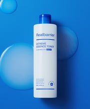 ProtoClinical k-beauty white beauty product silhouette centered between deep blue side panels on a light background.