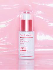 [Real Barrier] PDRN Glow Repair Serum 30ml by ProtoClinical shown in product packaging with soft pink and beige tones on a light background for a k-beauty skincare routine.