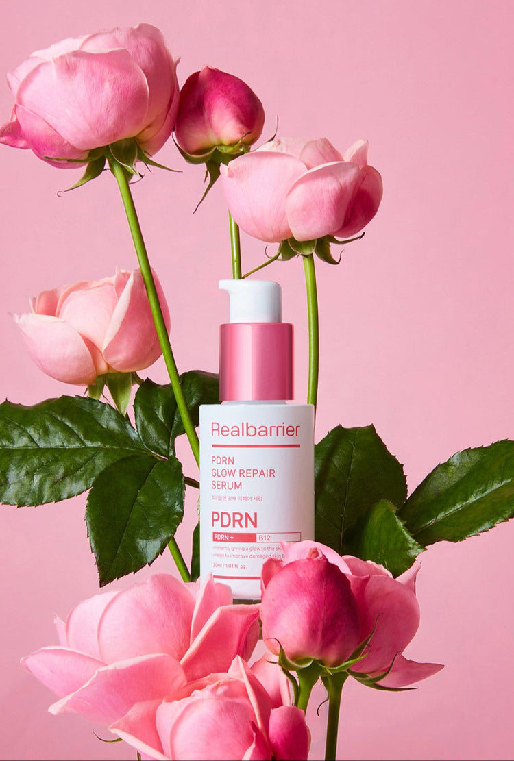 ProtoClinical k-beauty [Real Barrier] PDRN Glow Repair Serum 30ml packaging with pink and beige horizontal bands on a soft pink background.