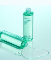 ProtoClinical k-beauty abstract beauty graphic with aqua lower tones on a pale blue background.