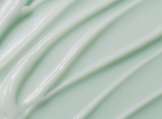 ProtoClinical k-beauty abstract beauty graphic with muted sage green tones on a light background.