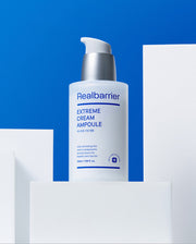ProtoClinical k-beauty abstract beauty graphic with a pale center, bright blue left edge, and warm peach tones on the right.