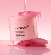 ProtoClinical k-beauty MEDICUBE: PDRN Pink Collagen Gel Toner Pad / (70pads) (120ml) in an open pink jar with a textured gel pad draped over the rim and a translucent pink jelly swatch on a pale pink background
