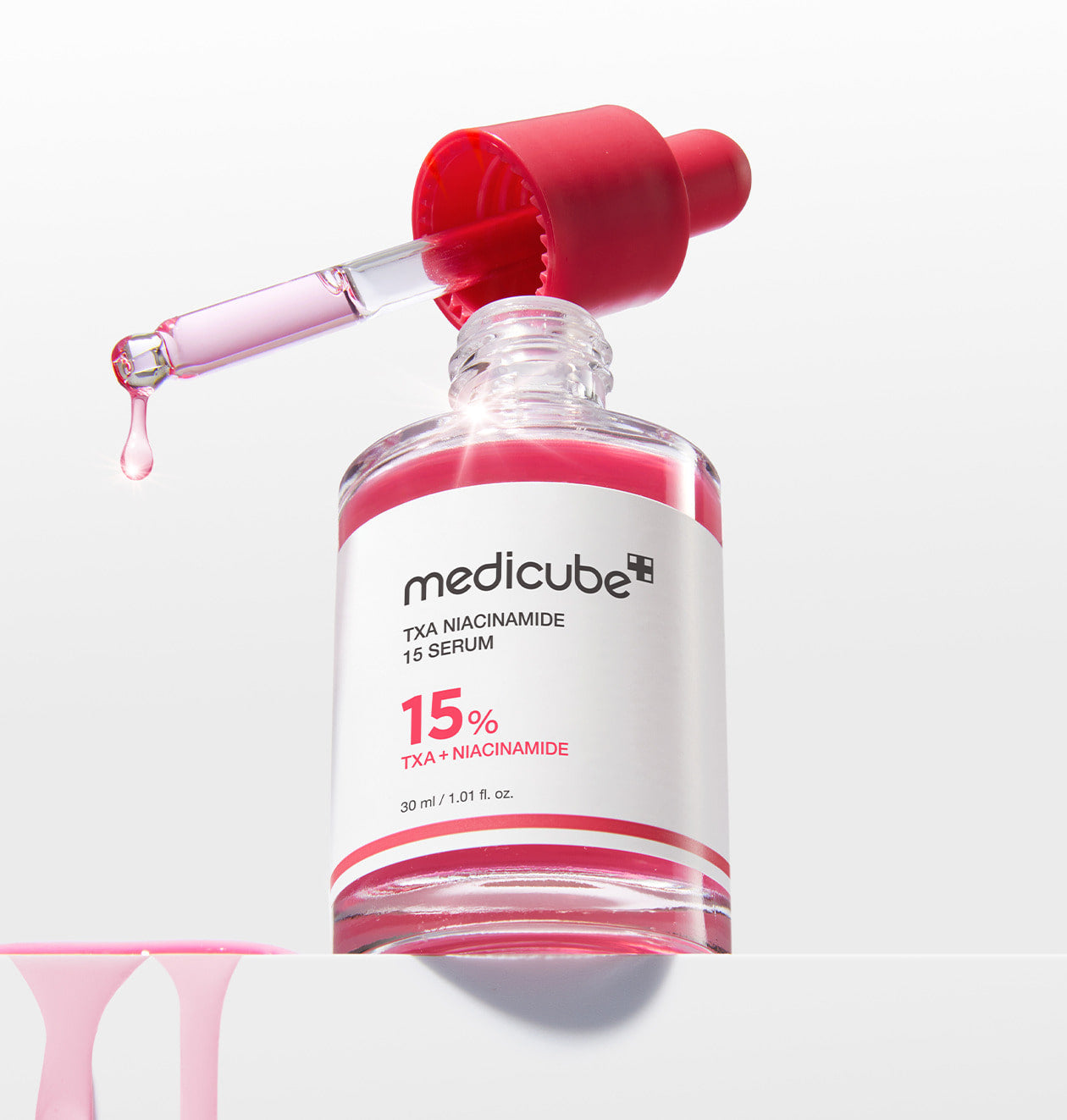 ProtoClinical k-beauty MEDICUBE: Txa Niacinamide 15% Serum (30ml) single upright pale pink serum bottle centered on a light background with soft blue side accents
