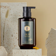ProtoClinical k-beauty [Daeng Gi Meo Ri] Ki Gold Shampoo 500ml in a single upright rounded shampoo bottle with a brown center panel, pale peach side accents, and a front-facing label on a light background