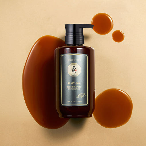 ProtoClinical k-beauty [Daeng Gi Meo Ri] Ki Gold Shampoo 500ml shown as a single rounded shampoo bottle with a brown center panel, pale peach side accents, and a light background