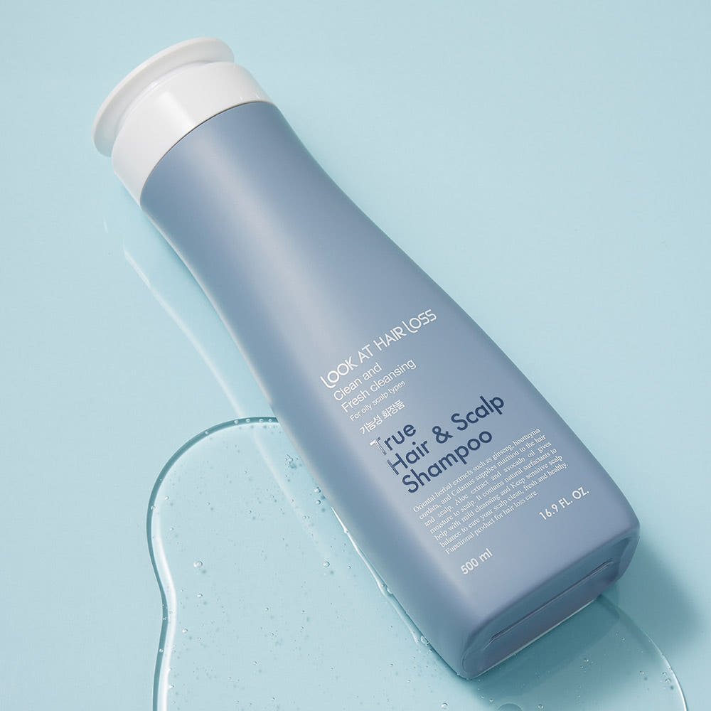 ProtoClinical k-beauty [Daeng Gi Meo Ri] Look At Hair Loss True Hair & Scalp Shampoo 500ml shown as an abstract beauty close-up with a blurred dark vertical form on a pale aqua and blue background.