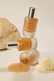 ProtoClinical k-beauty soft beige beauty product packaging on a light cream background.