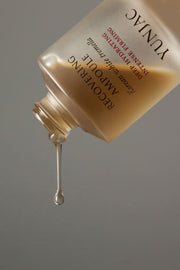 ProtoClinical k-beauty warm brown beauty product packaging on a soft blue-gray background.