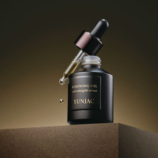 ProtoClinical k-beauty dark brown beauty product packaging on a clean white background.