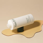ProtoClinical k-beauty warm beige beauty graphic with a darker horizontal center on a light background.