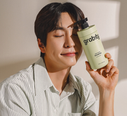 ProtoClinical k-beauty warm golden beauty graphic with a bright center on a soft beige background.