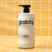 ProtoClinical k-beauty pale gray beauty product silhouette with soft blue lower accents on a white background.