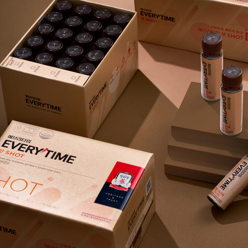 ProtoClinical k-beauty beige beauty product packaging on a dark brown background.