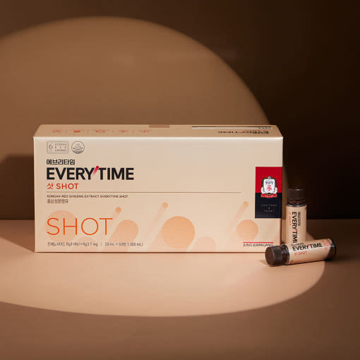ProtoClinical k-beauty beige beauty product packaging on a dark brown background.