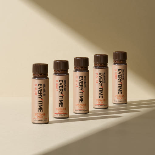ProtoClinical k-beauty beige and olive beauty product packaging on a light background.