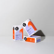 ProtoClinical k-beauty three pale neutral rounded beauty products on a light background.